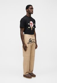Icecream Spray Paint Running Dog Pants